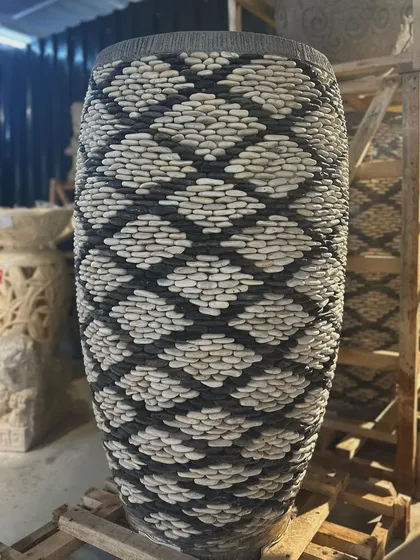 The detail on this majestic 4-foot tall pebble planter is just breathtaking. Each stone is placed by hand by local artisans, creating a unique, textural masterpiece for your home or garden.