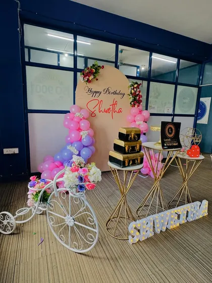 This view captures the full arrangement, including the decorative bicycle, providing a complete picture of the birthday decor package.