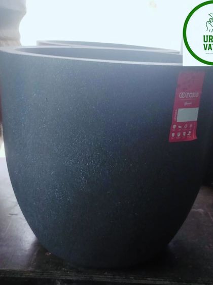 A simple, dark grey, U-shaped fiber pot.