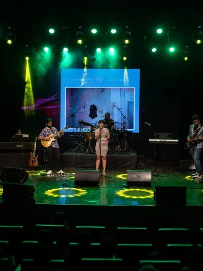 On stage hosting Muscape 2024, a large-scale music concert. Having organized my own shows, I have a deep understanding of the backend coordination required, from sound checks to artist management, which helps me keep the event running smoothly.