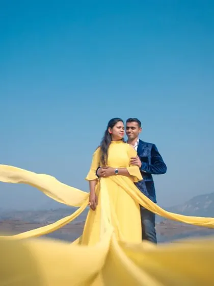 The beauty of our yellow trail gown is its versatility. It looks just as stunning against a mountain landscape as it does on the beach, offering a bright and cheerful vibe for your pre-wedding photos.