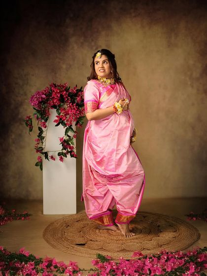Another angle from the traditional Nauvari saree shoot, capturing a different expression of joy and anticipation.