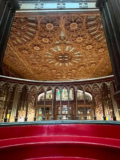 The intricately carved wooden ceiling at Livraria Lello is a masterpiece in itself. Details like this, preserved over time, are what make historic spaces so magical. They remind me of the importance of looking up and appreciating the craftsmanship all around us.
