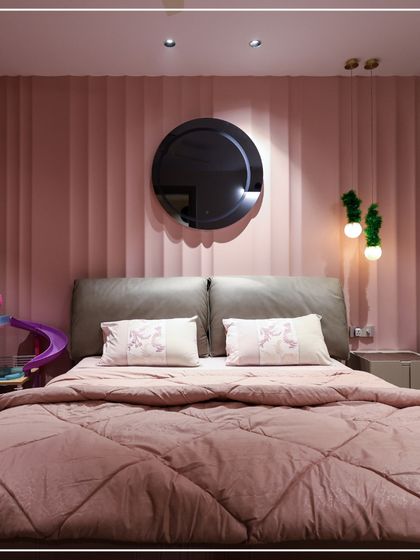 A playful and sweet bedroom design, perfect for a child or teenager. The soft pink color palette, fluted wall panels, and whimsical decor create a space that is fun, stylish, and full of personality.