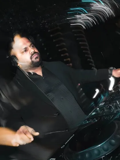 A motion-blur shot capturing the dynamic energy of a wedding DJ set. Even in a formal setting, the goal is always to create movement and excitement on the dance floor.