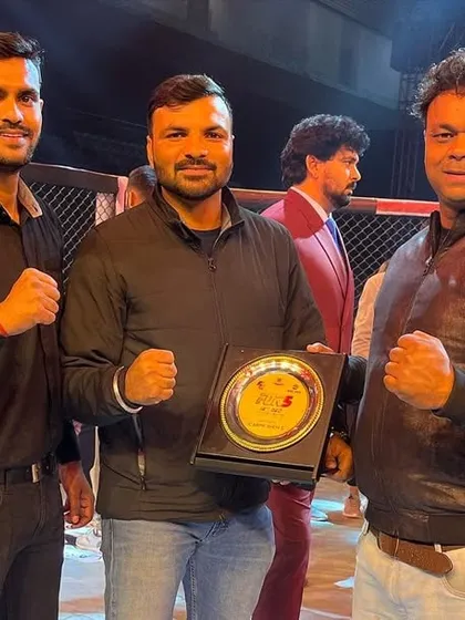 Honored to receive a plaque at the FOK5 MMA League event. It's a recognition of our team's contribution to the sport.