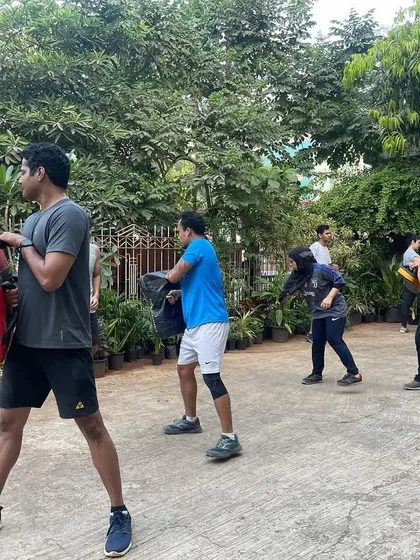 Starting the day strong with our morning outdoor batch. We take the training outside to work on kickboxing drills with pads and shields in the fresh air.
