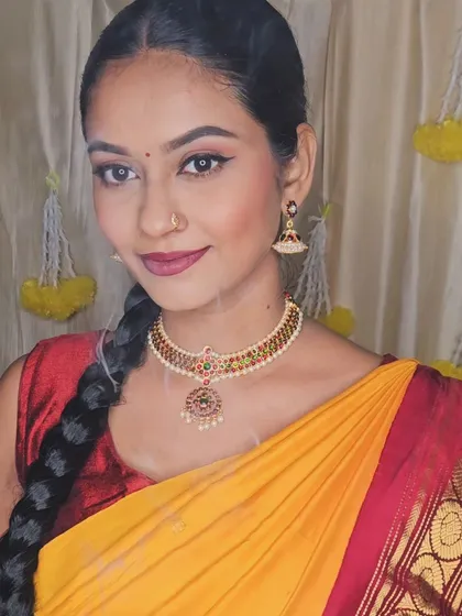 A festive Diwali look. The makeup is traditional and glamorous, perfect for celebrating the occasion.