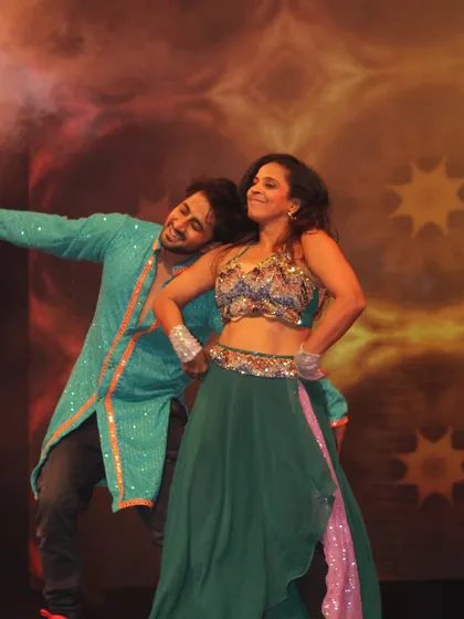 Capturing that perfect moment on stage. This is the goal for every couple's dance I choreograph: a moment of connection and joy that you'll remember forever. This shot shows a beautiful, relaxed pose during a sangeet duet.