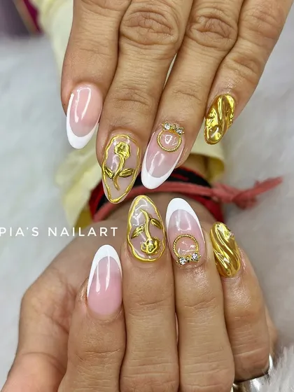 A classic French manicure with a touch of gold. This set features sculpted 3D chrome roses and accents for a look that is pure luxury.