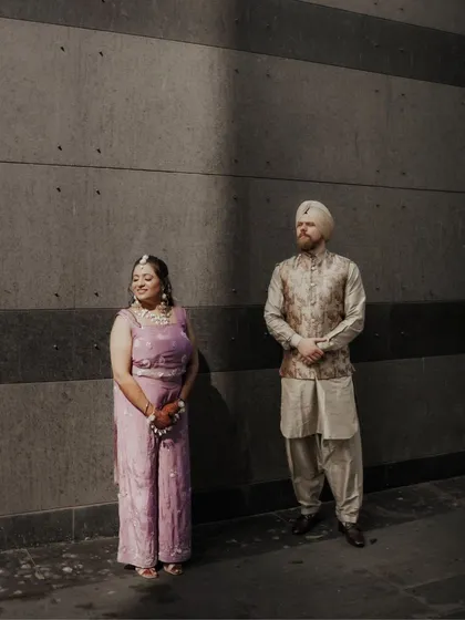 An artistic shot of Paramneet and Samuel, with a dramatic shadow creating a high-contrast, modern, and stylish portrait.
