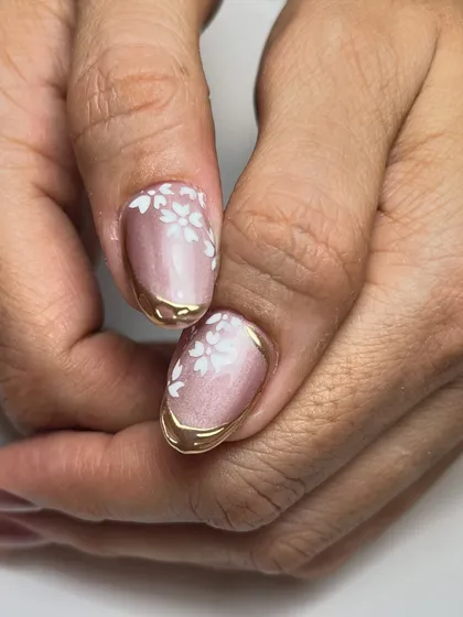 A close-up of the floral and chrome design, showing the detail in the hand-painted flowers and the smooth application of the gold chrome.
