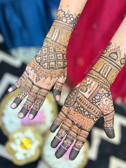 A mix of styles, with a check pattern on one hand and a peacock motif on the other, showing the variety available for family members.