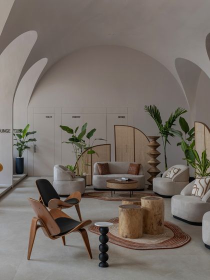 A look at the private lounge areas, defined by the repeating rhythm of the architectural vaults. The design balances open social spaces with more intimate nooks for private meetings.