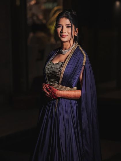 For this client's Sufi night, we went with a flowy purple gown with a cape. Paired with a classic diamond necklace and a chic updo, it created a timeless and elegant look.