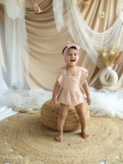 "AMMA". A mother and daughter share a joyful, dancing moment.