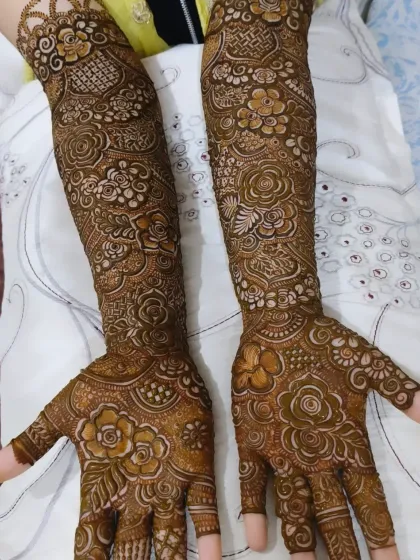 This full coverage bridal mehndi is a great example of how I blend different elements, from checkered patterns to blooming roses, into one cohesive design.