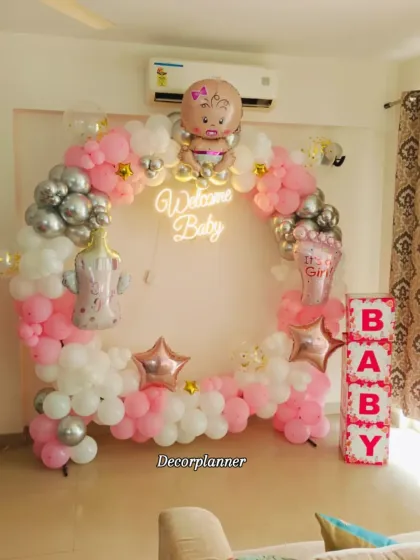 A full view of the "Welcome Baby" circular arch setup, including the personalized "BABY" blocks. This shows how different decorative elements can be combined to create a complete and cohesive look.
