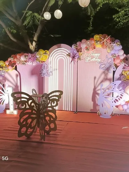 The full view of the enchanting butterfly birthday setup. I work to ensure every element, from the balloons to the props, fits the theme perfectly.