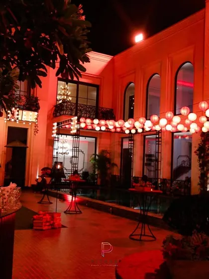 For the "Call Me Bae" series set, we transformed this courtyard into a vibrant evening space. A canopy of glowing lanterns and bold red lighting created an atmosphere that was both energetic and sophisticated, perfect for a high-end social scene.