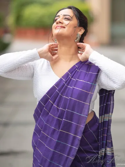 A candid moment that captures the light and airy feel of the cotton saree.