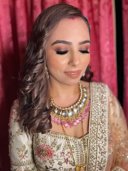 The glossy lip and glowing skin were the perfect finishing touches for Akshita's reception glam.