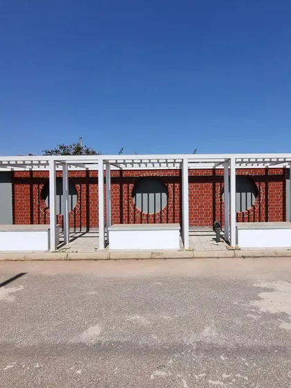 An identical view of the modern pergola structures.