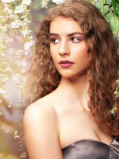 For this beauty portrait, I used a floral background and soft, diffused light to create a dreamy, ethereal atmosphere. The model's expression is calm and serene.
