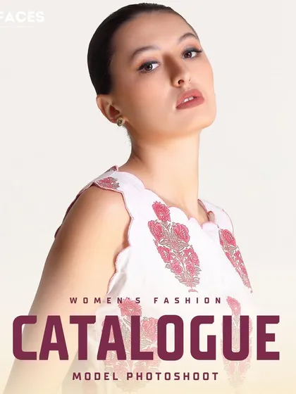 A high-fashion shot of a model in a white printed top. The strong pose and clean background make this an impactful image for a brand's catalogue or campaign.