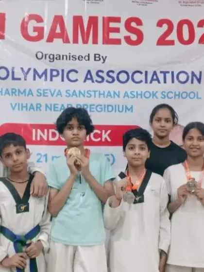 A proud team moment at the Delhi Olympic Games 2025. We believe in growing together, and this picture captures the spirit of Team Prahar, where every participant is a champion.
