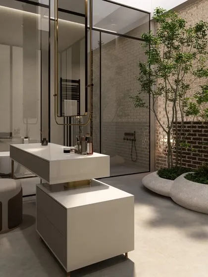 We designed this luxury bathroom to feel like a private spa, complete with an indoor courtyard that brings a living tree into the space. The glass partitions and minimalist vanity create a sense of openness, blurring the line between the built environment and nature.