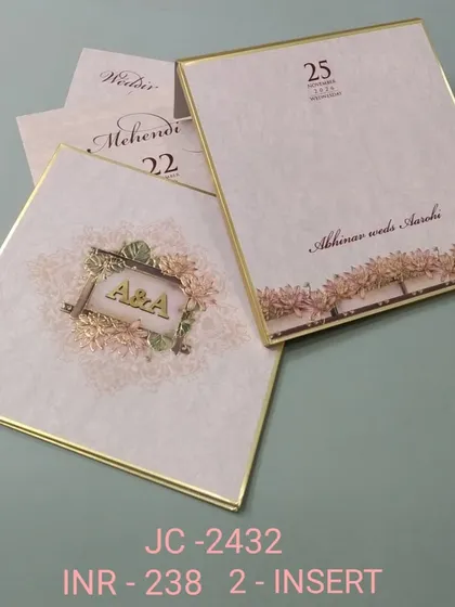 A classic and elegant invitation with a gold-trimmed frame and a custom 'A&A' monogram. This two-insert card is perfect for a timeless and formal wedding celebration.
