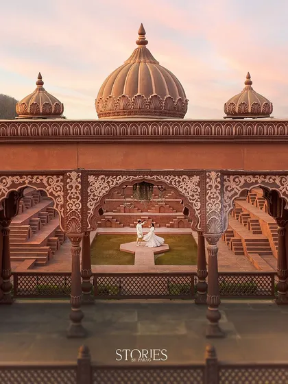 Using a drone, I can capture your love story from a grand perspective. This shot at Sets in the City shows how we can create a truly epic and royal pre-wedding portrait that feels like a scene from a movie.