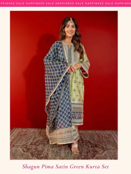 My Shagun Pima Satin Green Kurta Set is perfect for festive occasions. The rich green is paired with a contrasting navy blue dupatta for a truly elegant look.