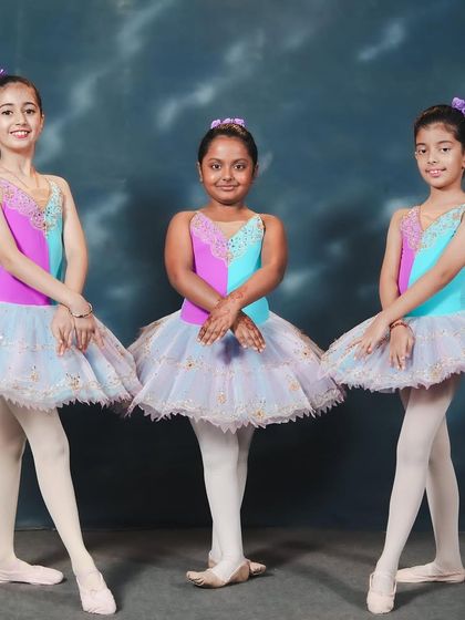 Our ballerinas in their vibrant costumes for 'Waltz of Hours.' These photos capture the poised and polished look of our young performers before they take the stage.
