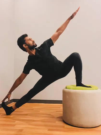 An extended side angle pose (Utthita Parsvakonasana) variation using a prop. This allows for a deeper stretch along the side of the body.