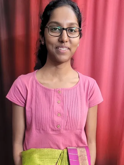 My student Dhivya, proud of the saree she pre-pleated during our workshop.