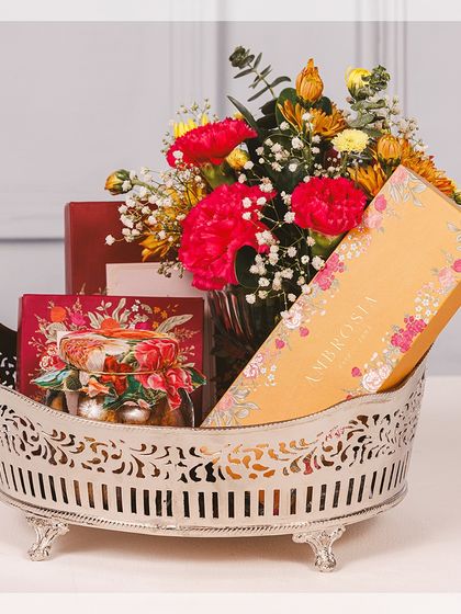 Our large Majestic Basket, filled with an assortment of our finest floral-packaged goodies, is designed to be a grand gesture of festive love.