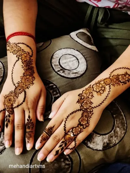 Mehandi isn't just for brides. We also teach elegant and modern designs like this beautiful floral vine, perfect for festival goers or wedding guests. This style is quick to apply and always in demand.