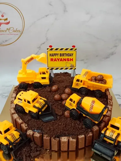 For a little builder's birthday, I turned this chocolate cake into a fun construction zone. The design features a KitKat border, crushed Oreo "dirt," and toy trucks, showing how I can bring any theme to life with creative, edible elements.