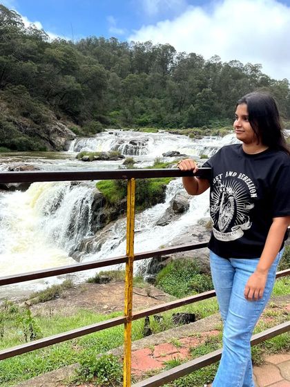 A serene moment for one of our travelers at the falls. Our trips offer a chance for personal reflection too.