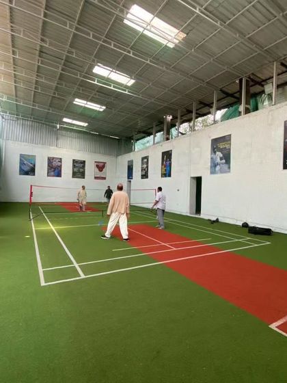 A wide view of the entire playing area. You can see the posters on the wall that keep the sporty vibe going.