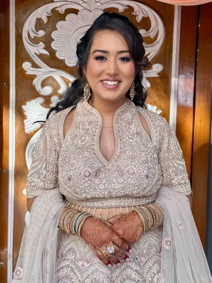 A happy, confident bride. The soft glam makeup enhances her features beautifully.