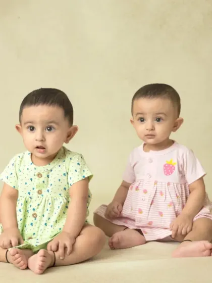 A collection of simple, classic portraits of twin babies. Without props or themes, their individual expressions and connection are beautifully highlighted.