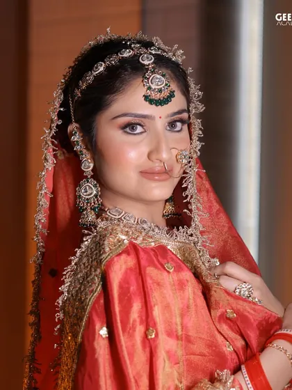 Student Work: This regal bridal look, inspired by Mughal art, features flawless skin and expressive eyes, demonstrating the high level of artistry our students achieve.