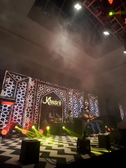 The band in full swing. This wide shot captures the live music and vibrant atmosphere of a wedding reception or sangeet.
