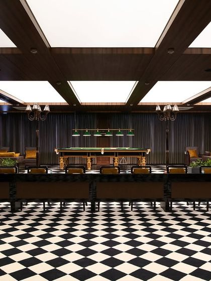 This recreation room at Arihant features fully automated lighting. Different scenes can be activated for meetings, events, or a game of pool, all from a central control panel.