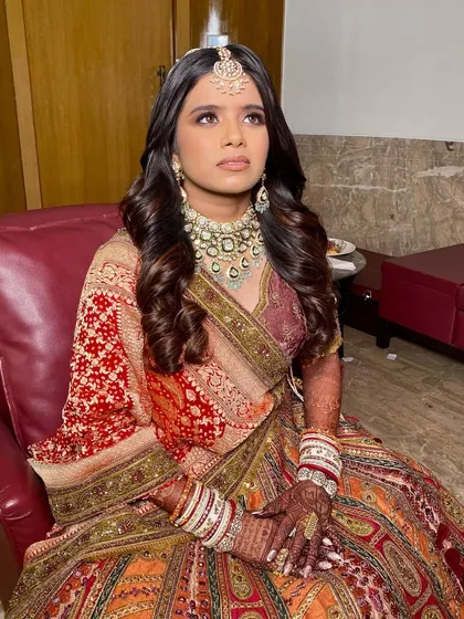 Twinkle looking up, showcasing her beautifully blended eyeshadow. The makeup is designed to look stunning from all angles and in all lighting conditions.