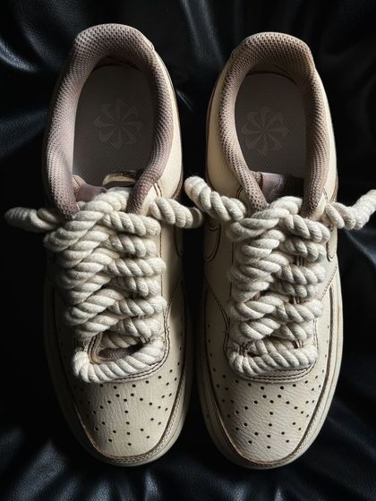 A pair of Nike Court Visions with a coffee-themed colorway and unique rope laces.