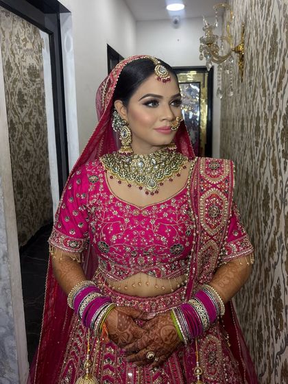 A three-quarter view of the bride, highlighting the beautiful contour and blush that gives her cheeks a healthy, rosy glow.